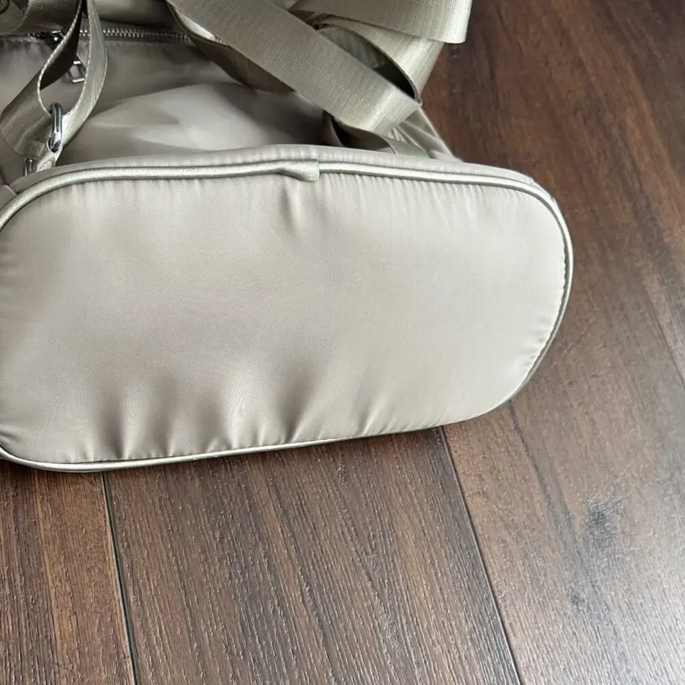 Neutral Taupe Woman’s Backpack with Metallic Accent and many zipper pockets. - Picture 4 of 13